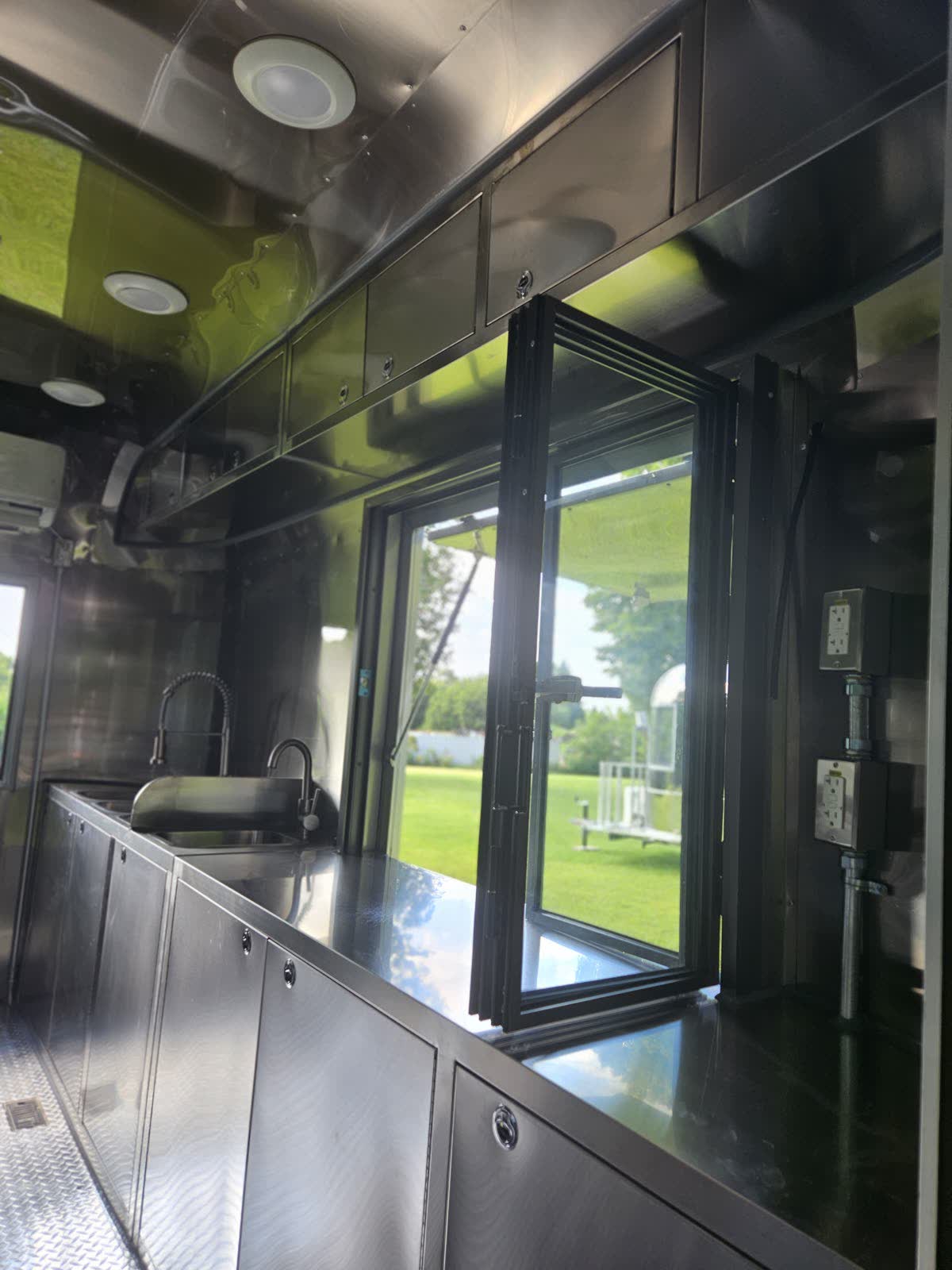 Bi-fold serving window, prep counter and hand sink