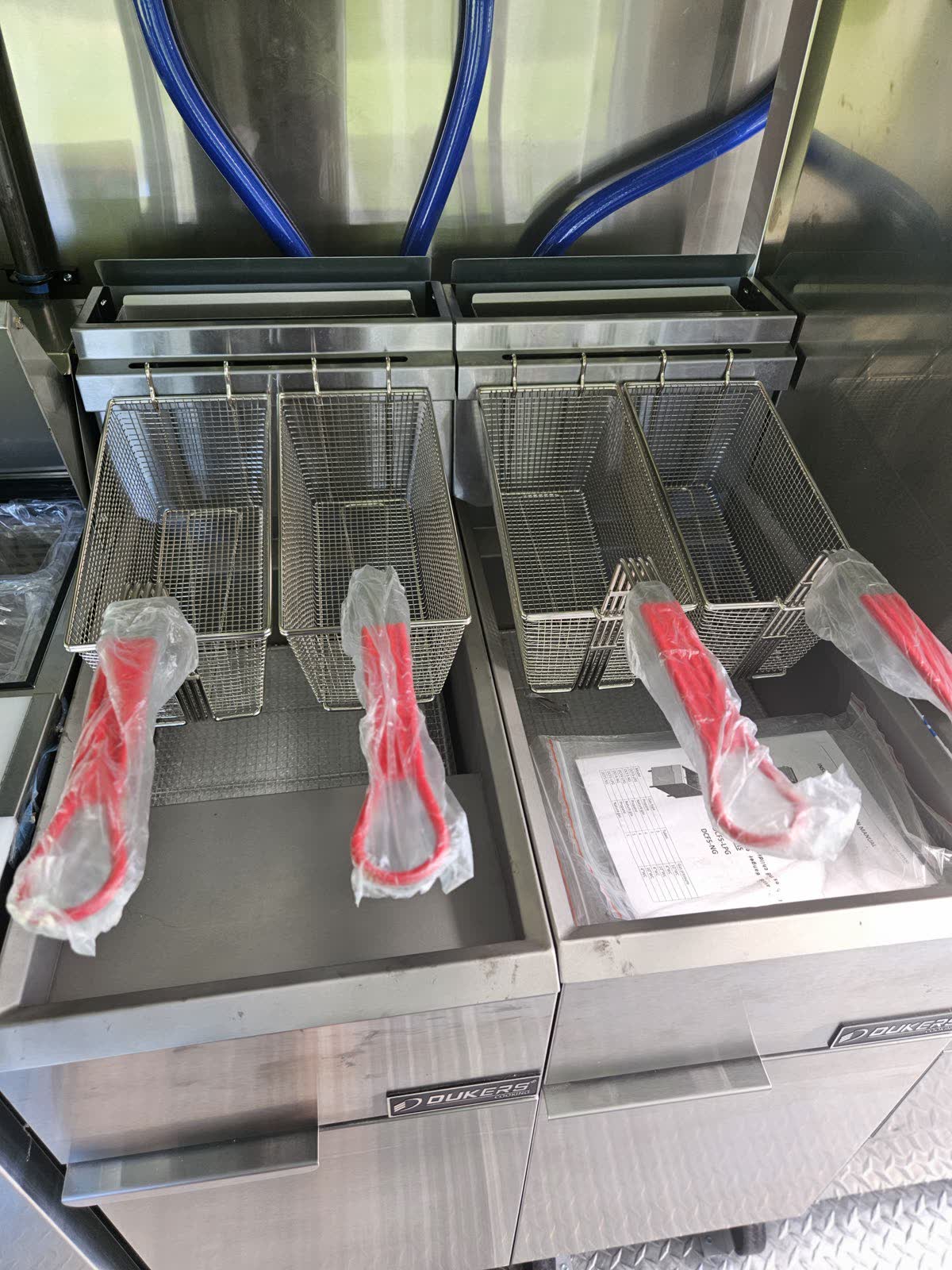 Twin commercial deep fryers with baskets