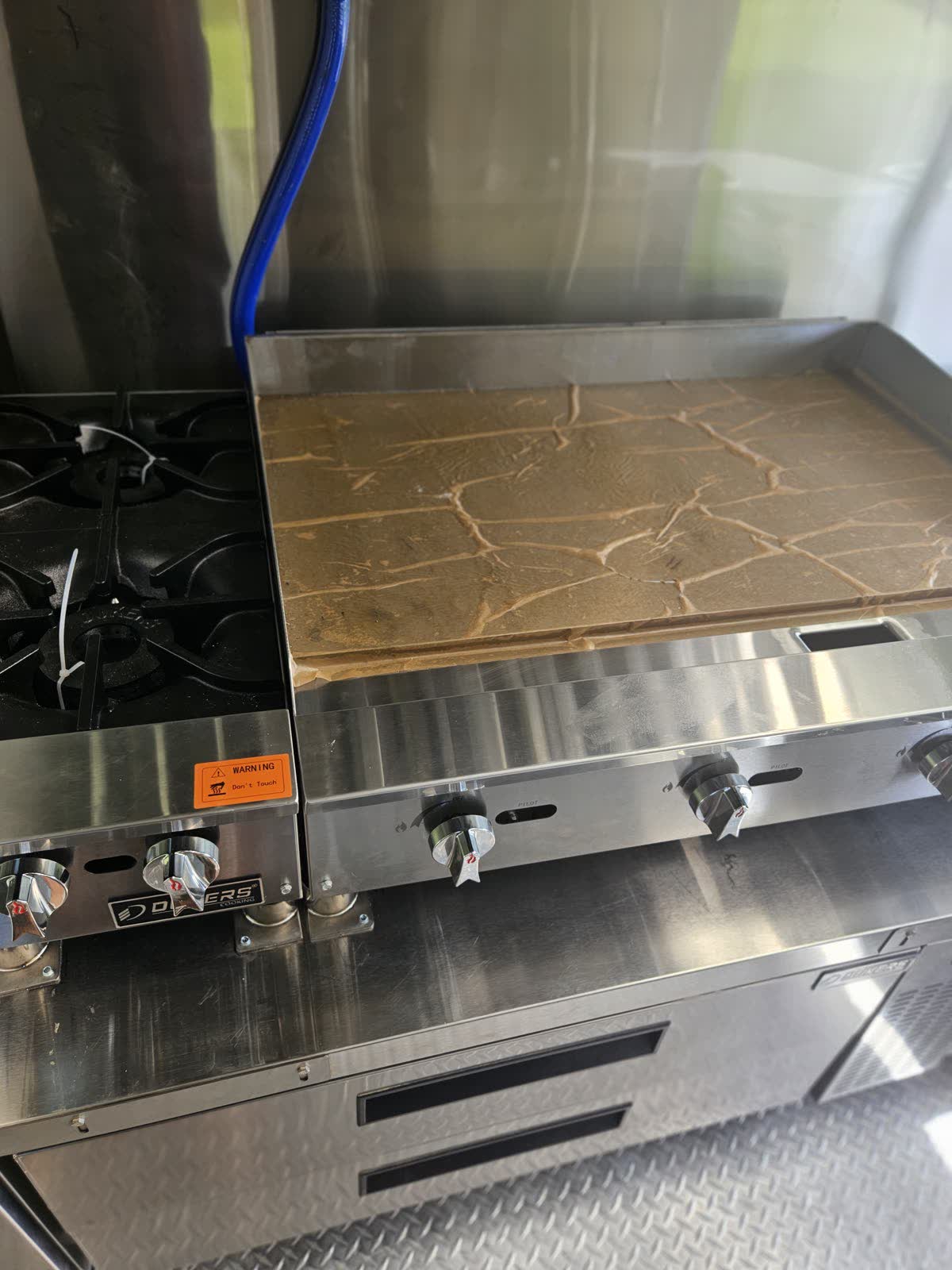 Six-burner gas range and flat top griddle